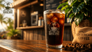 Tall glass of smooth cold brew El Paso coffee over ice on a wooden kiosk counter with roasted Puerto Rican beans nearby