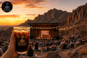 Concert-goers at Cool Canyon Nights El Paso 2026 at McKelligon Canyon amphitheatre at sunset, holding an iced cold brew